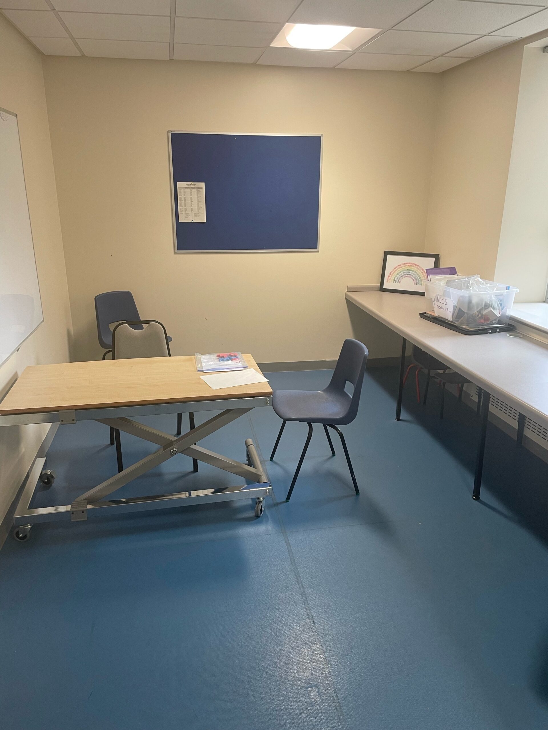 plain room with chair and tables